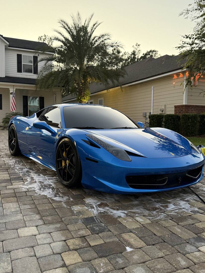 Blue Ferrari 458 freshly detailed at dusk