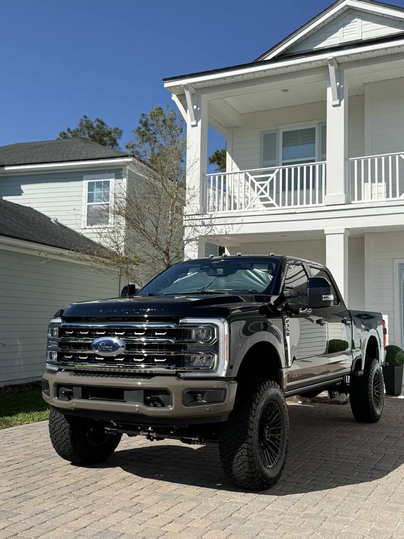 Lifted black Ford Super Duty after detailing