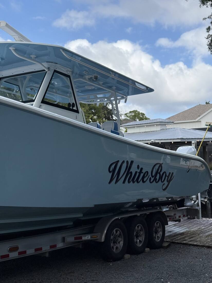 Center console boat detailed on its trailer